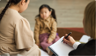 Two counselors with a child